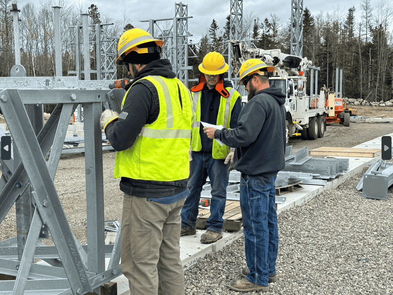 Power System Technicians Josh, Aaron and John assemble steel structures at the new Machias substation location off October Lane